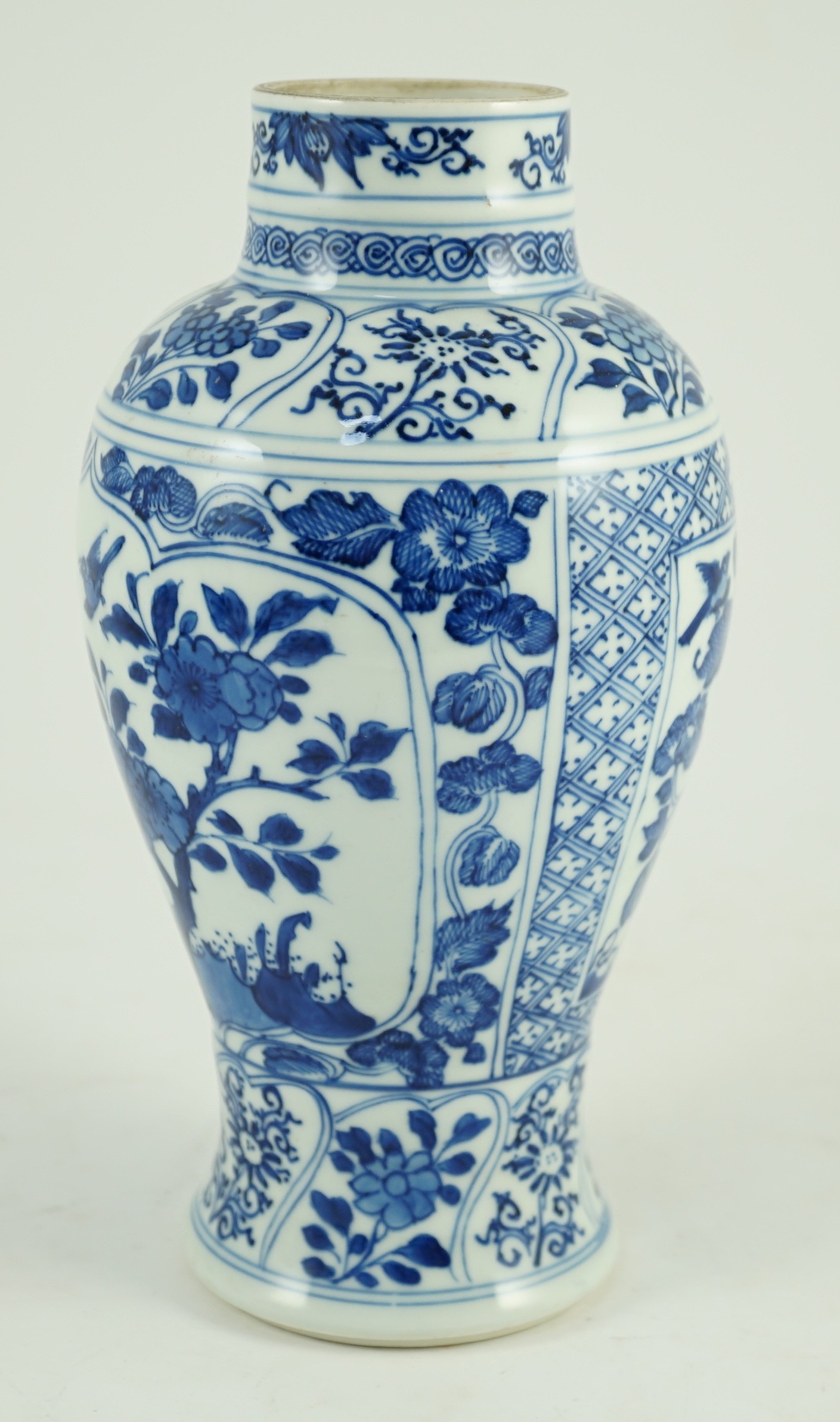 A Chinese blue and white vase, Kangxi period, 21cm high, hairline crack to neck